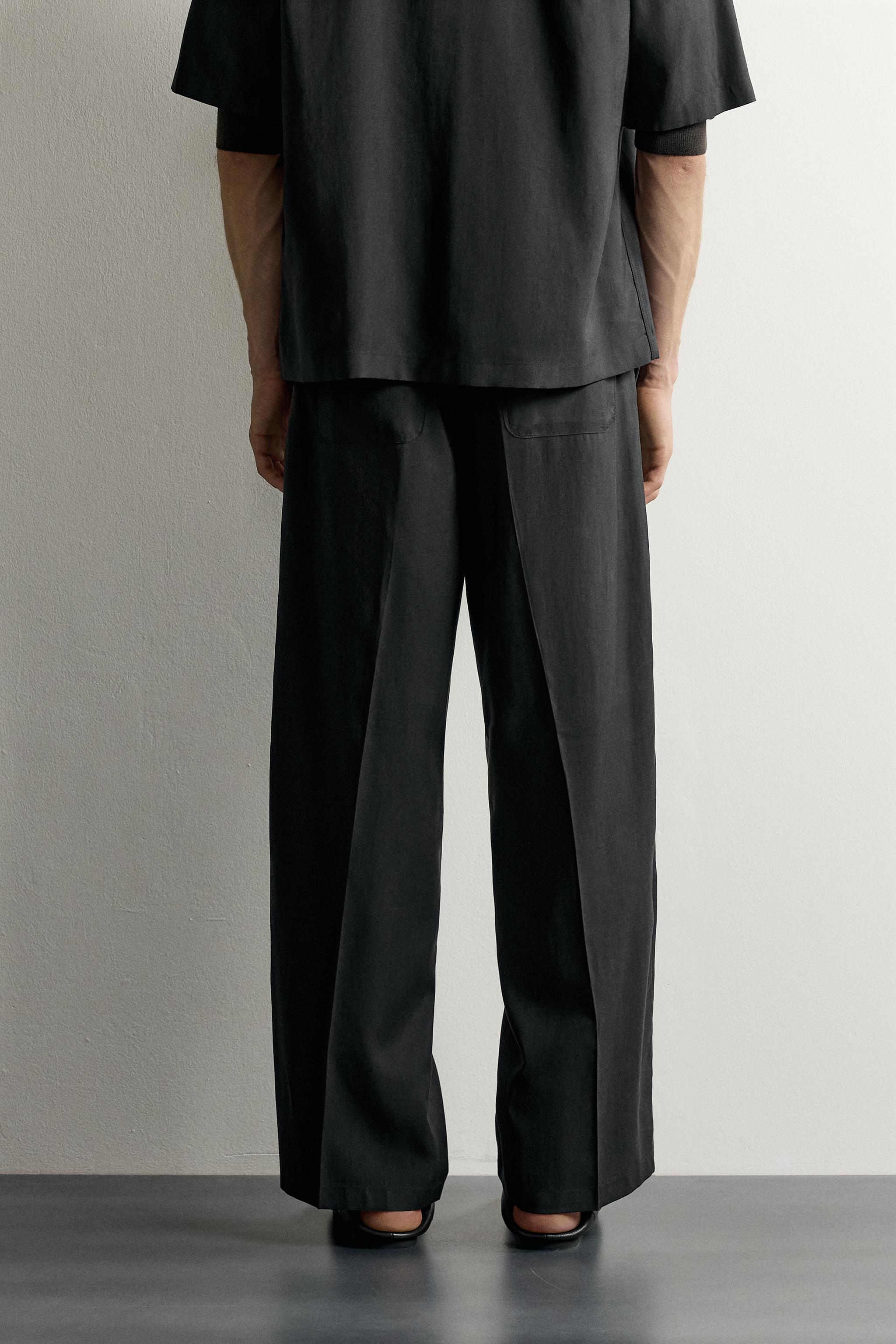 PLEATED FLOWY TROUSERS